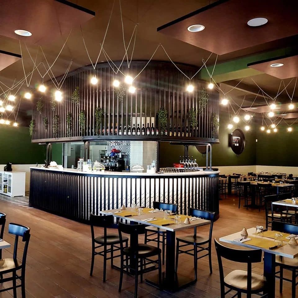 The round bar and the dining room at Padellone with string lights